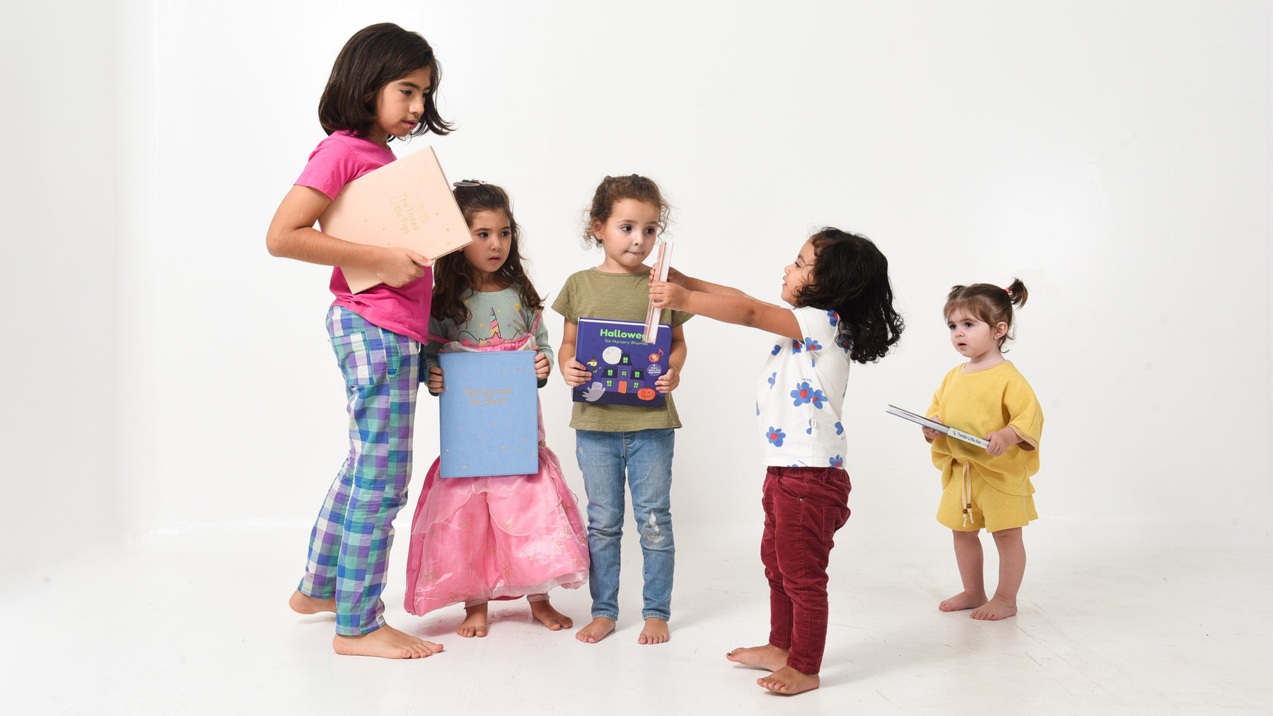 5 kids lining up standing and holding books. Children books, toddler activities, kids reading, reading activities, baby activities